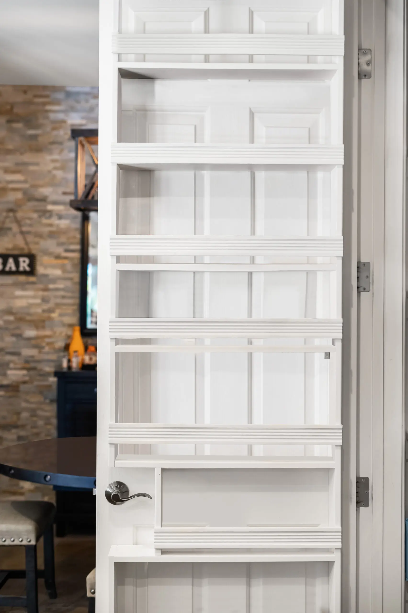 Hidden door bookshelf in dining room
