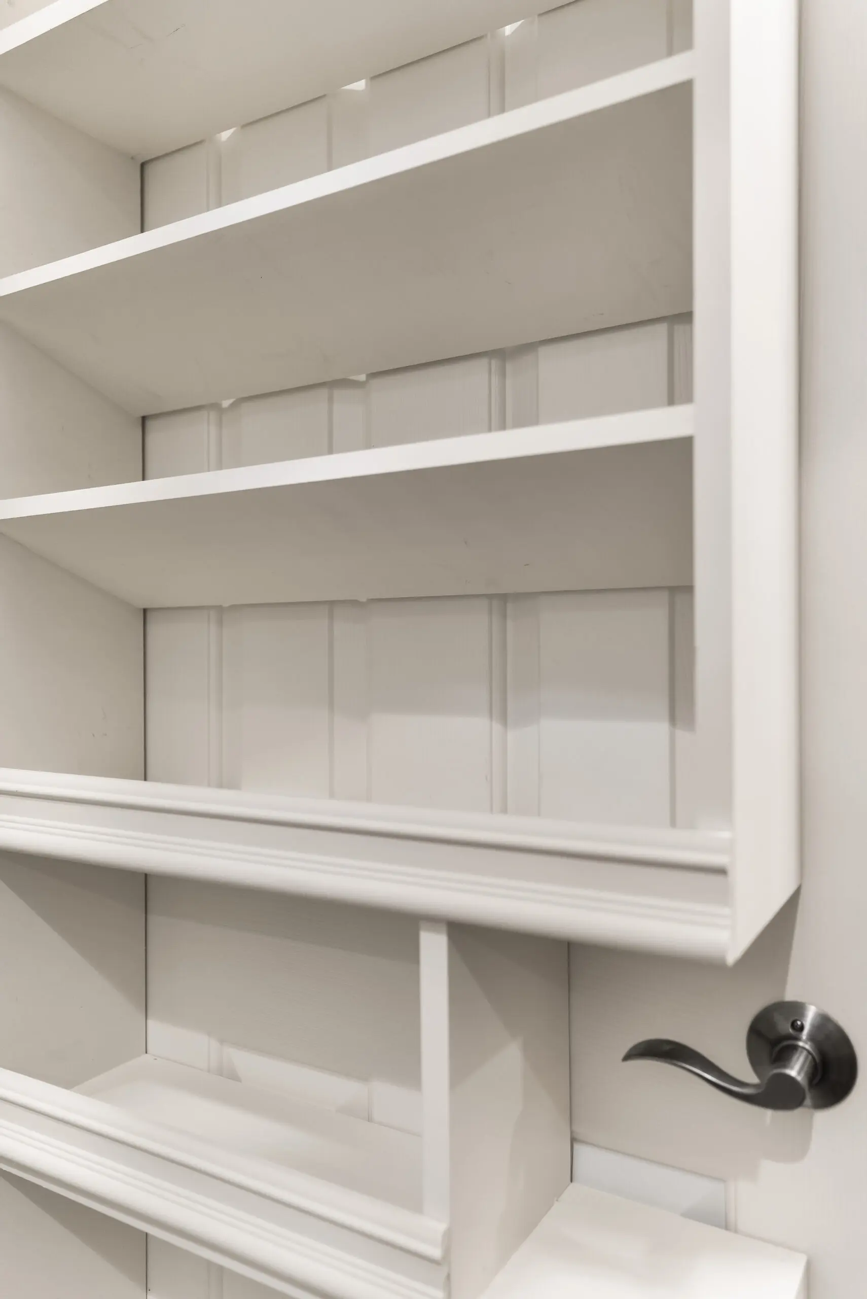 Minimalist white wall shelves with handle